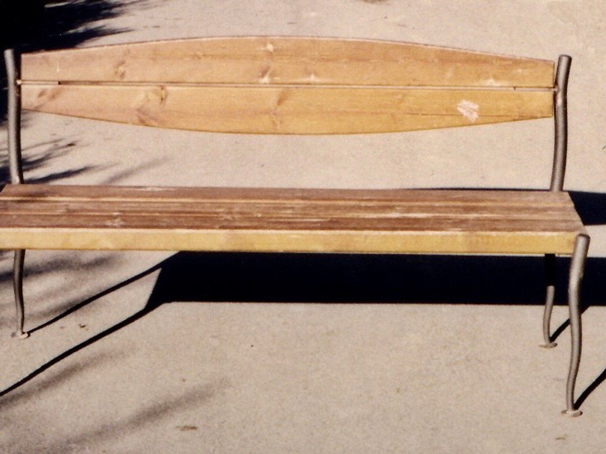 Handcrafted wooden bench with iron legs